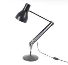 An angle poise type table lamp