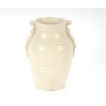 A Clarice Cliff cream coloured vase, with ribbed b
