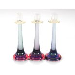 Three Italian amethyst tinted glass candlesticks m