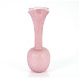 A pink satin glass vase having frilled rim with fl