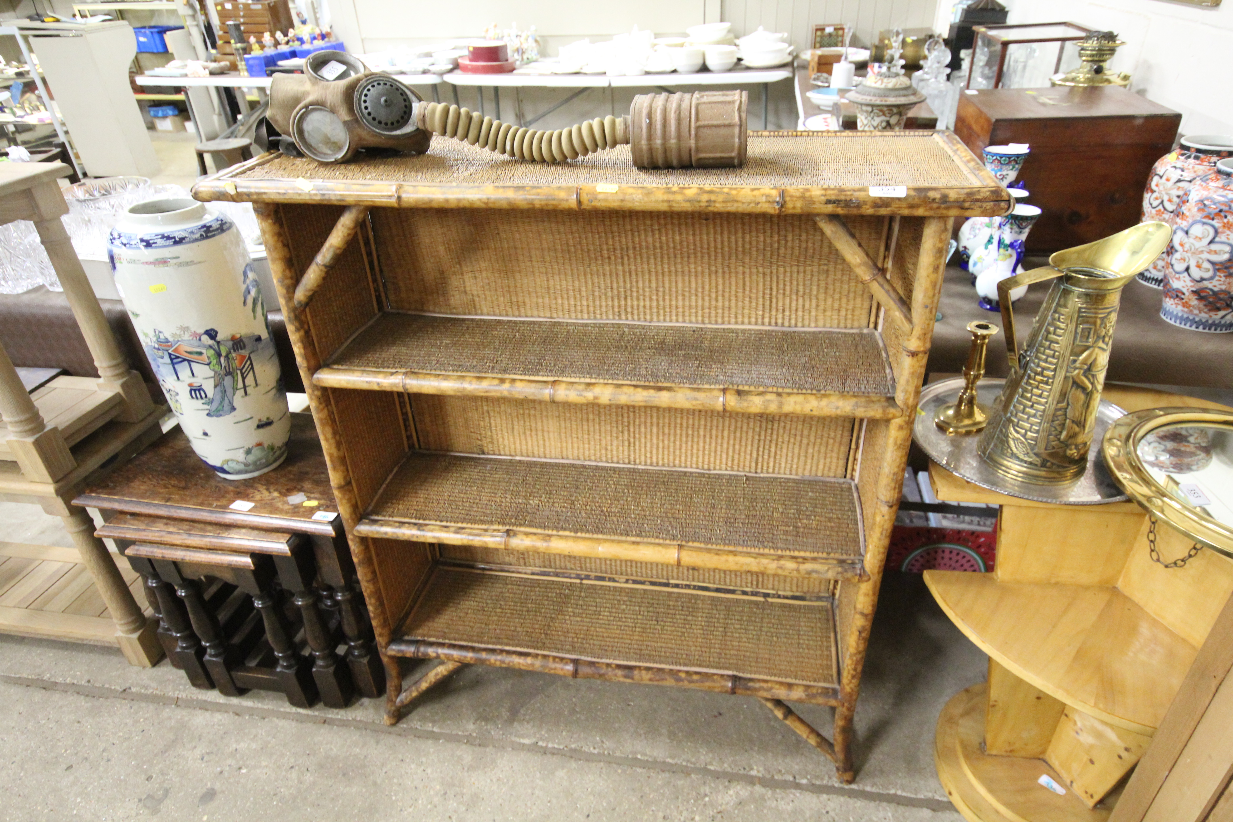 A Victorian bamboo and wicker open fronted bookcas