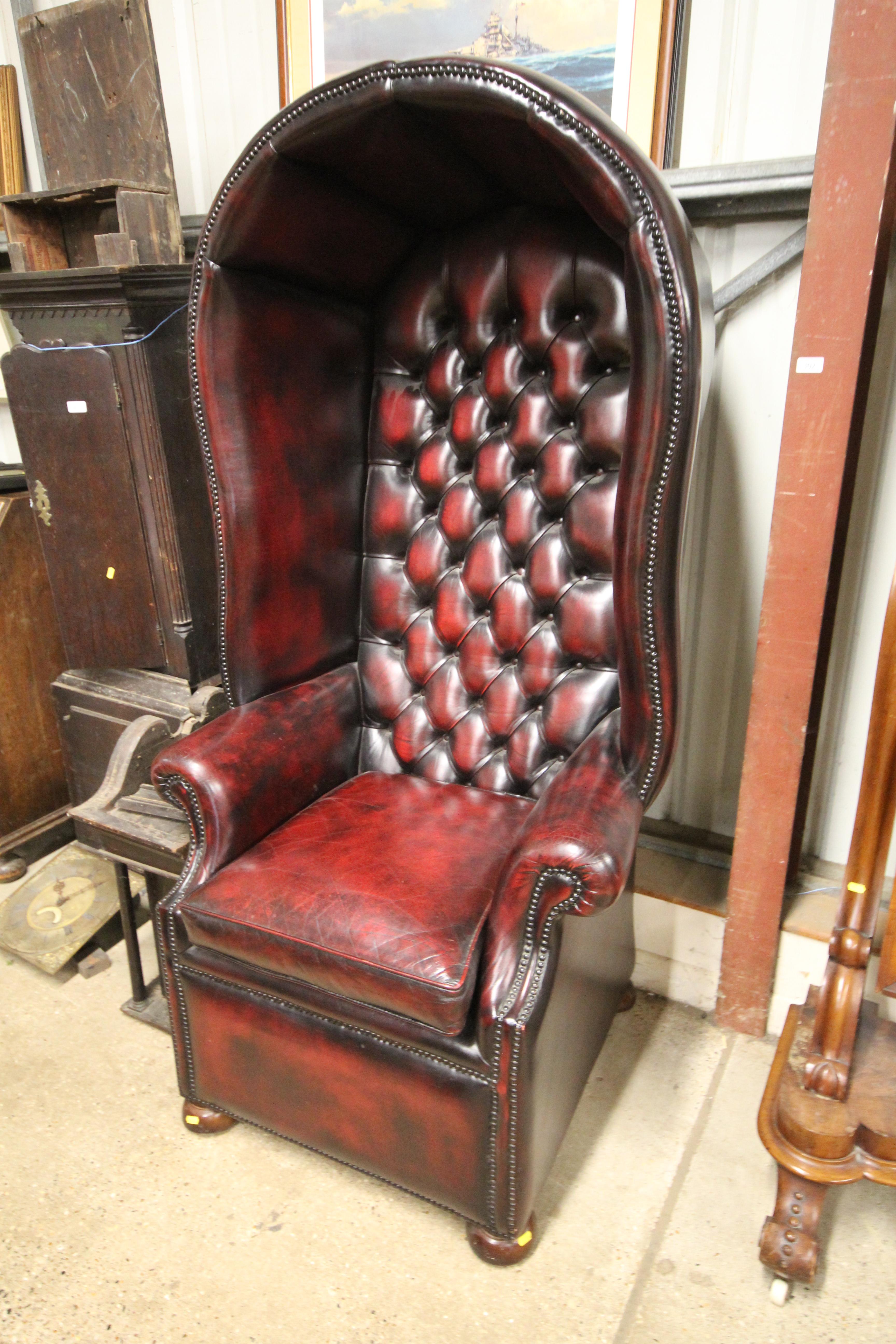 A buttoned leather hall porter's chair