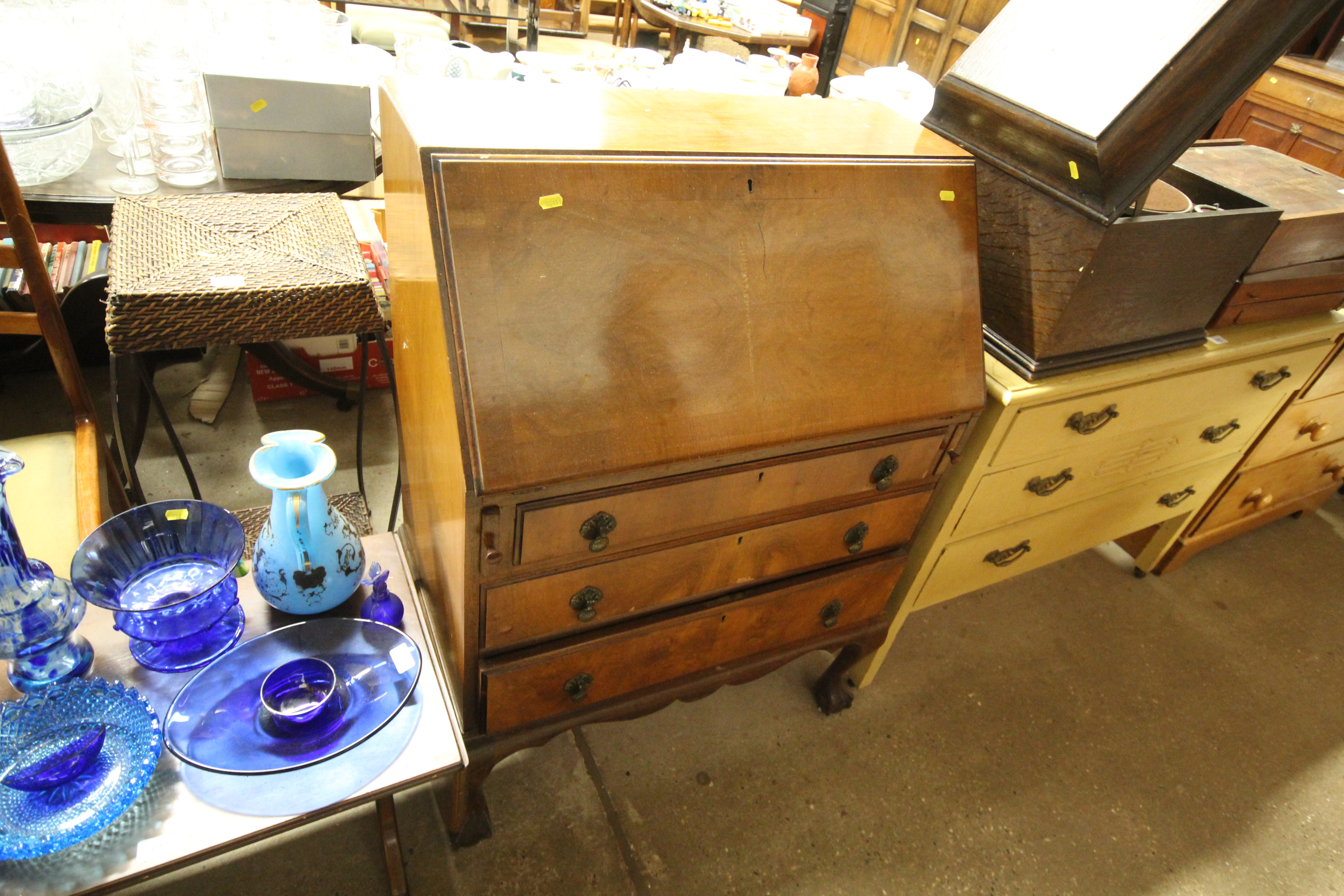 An early 20th Century walnut three drawer bureau