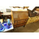 An early 20th Century walnut three drawer bureau