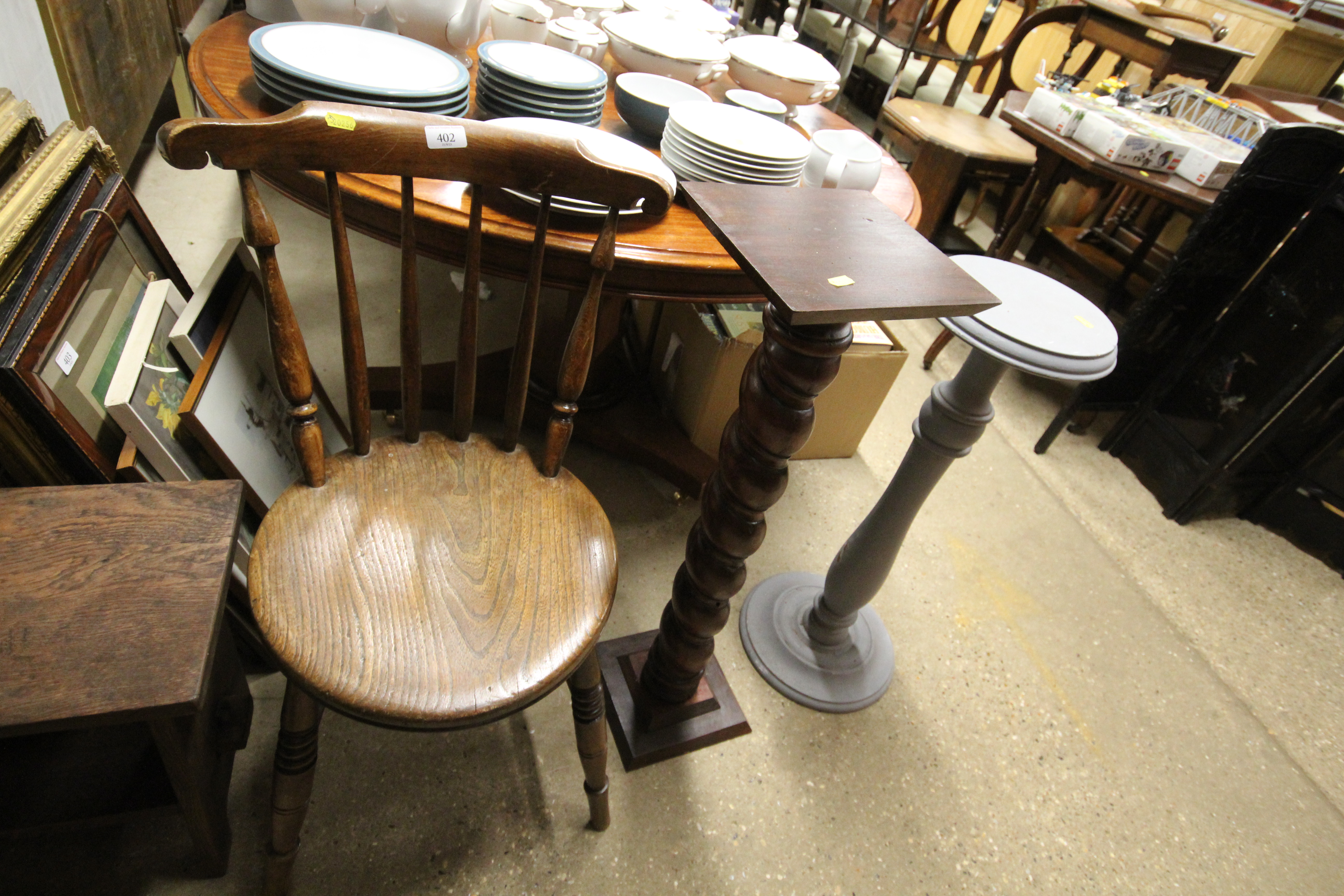 An Ibex chair and two plant stands