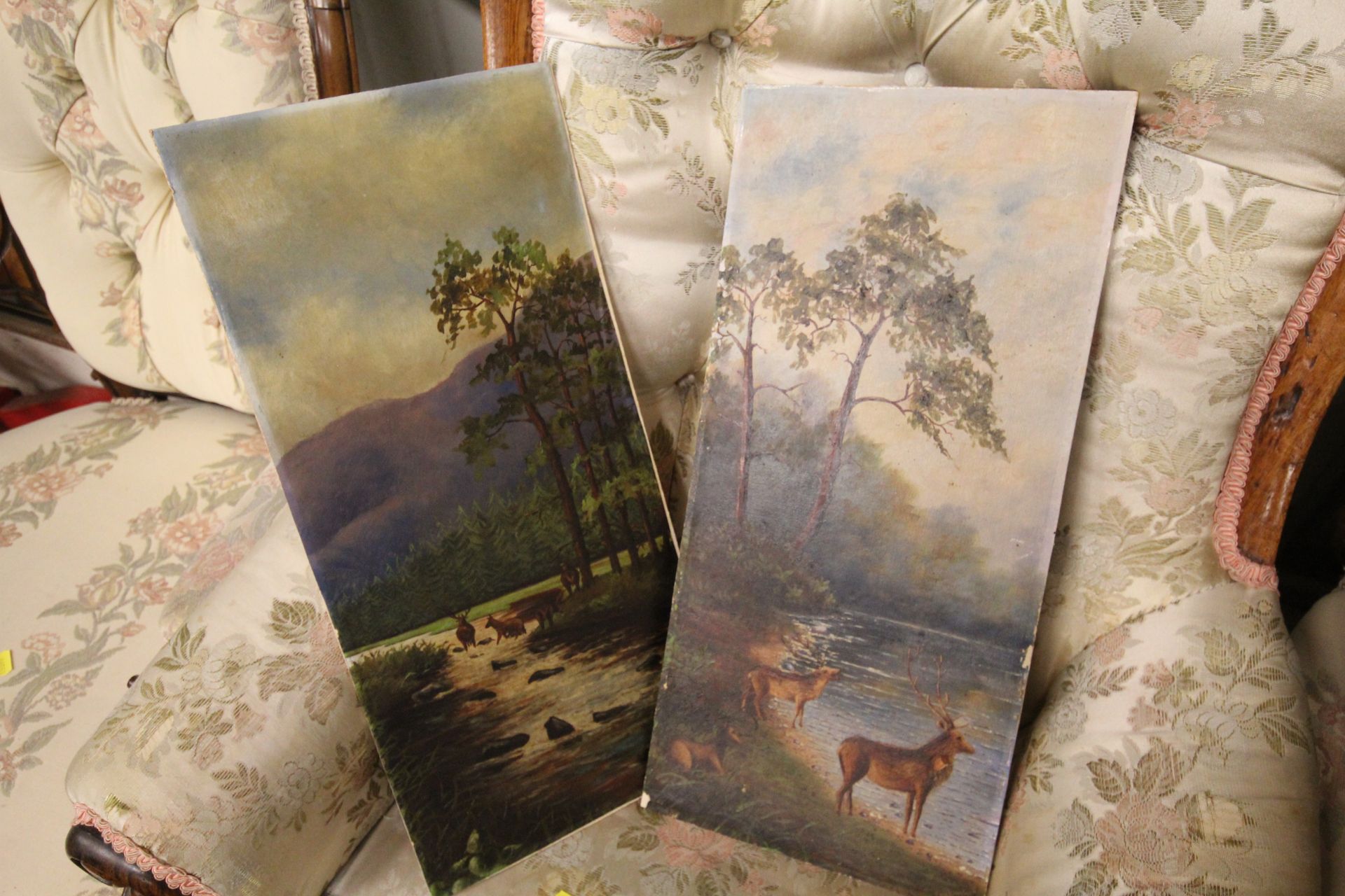 A pair of unframed oils depicting highland stags