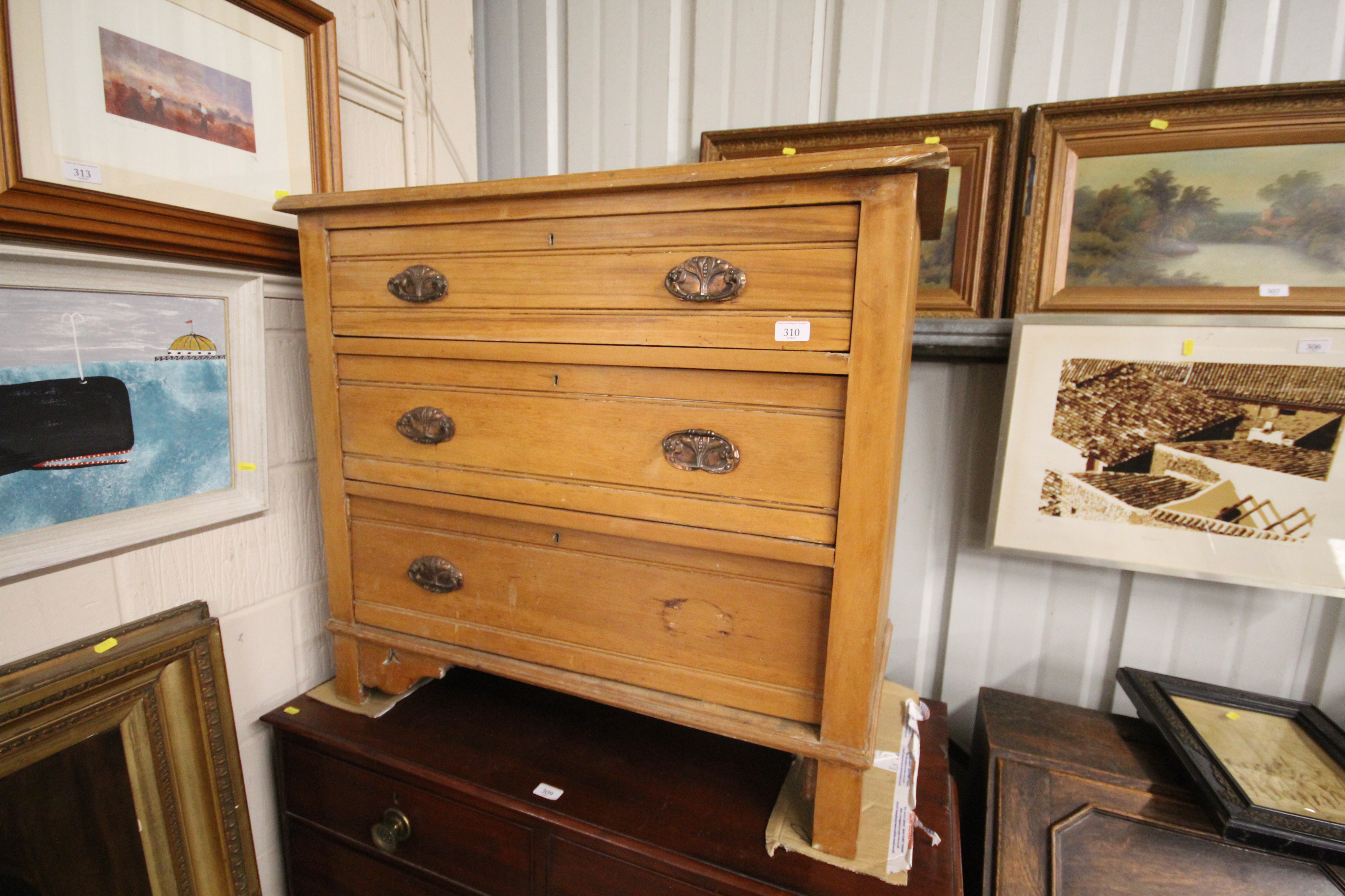 An Edwardian satin walnut three drawer chest