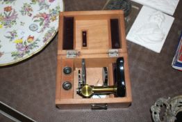 A 19th Century mahogany cased student microscope w