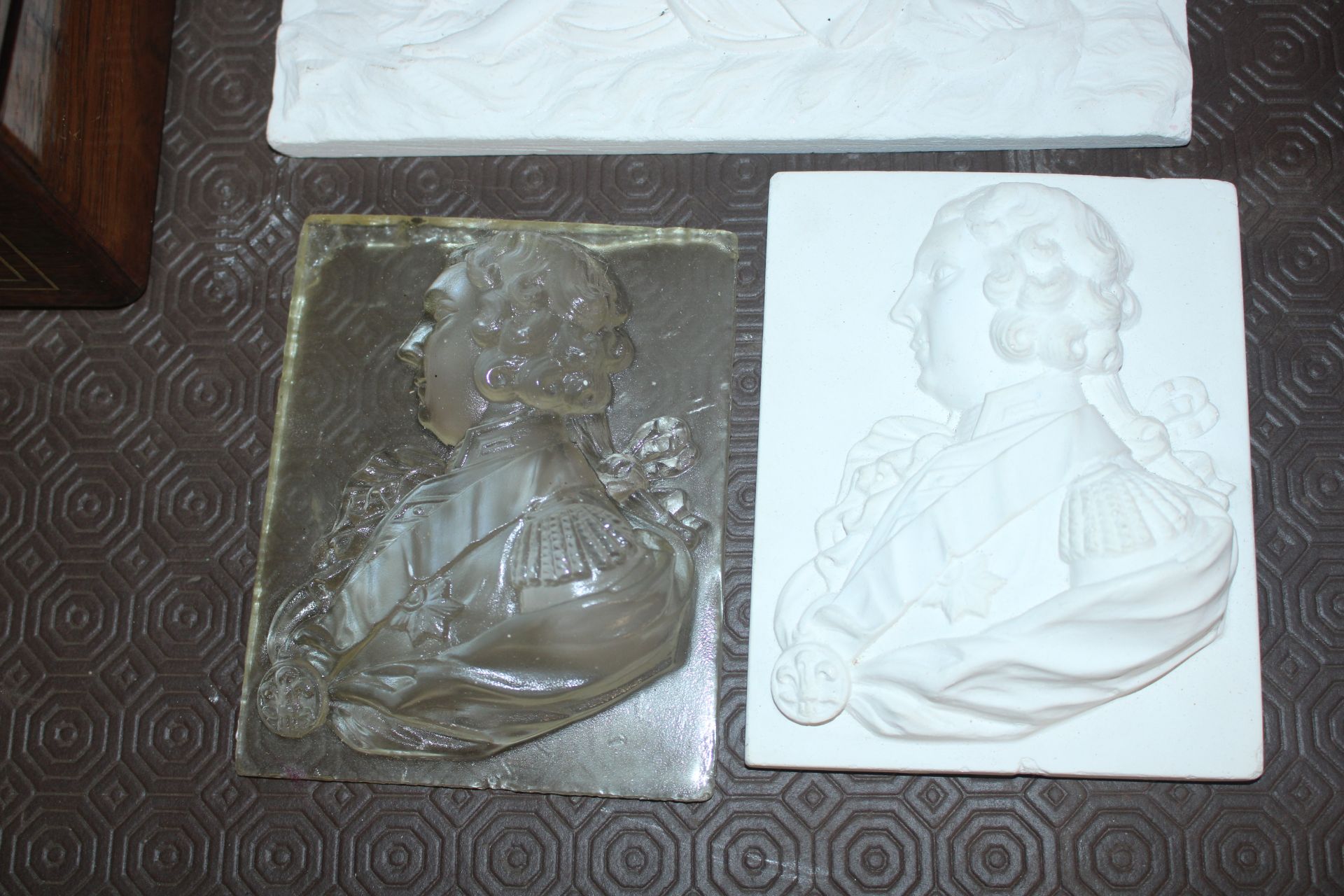 Two plaster applique busts; a Perspex similar; a p - Image 2 of 4
