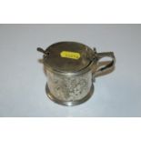 A Carrington & Co. silver mustard pot, hinged lid