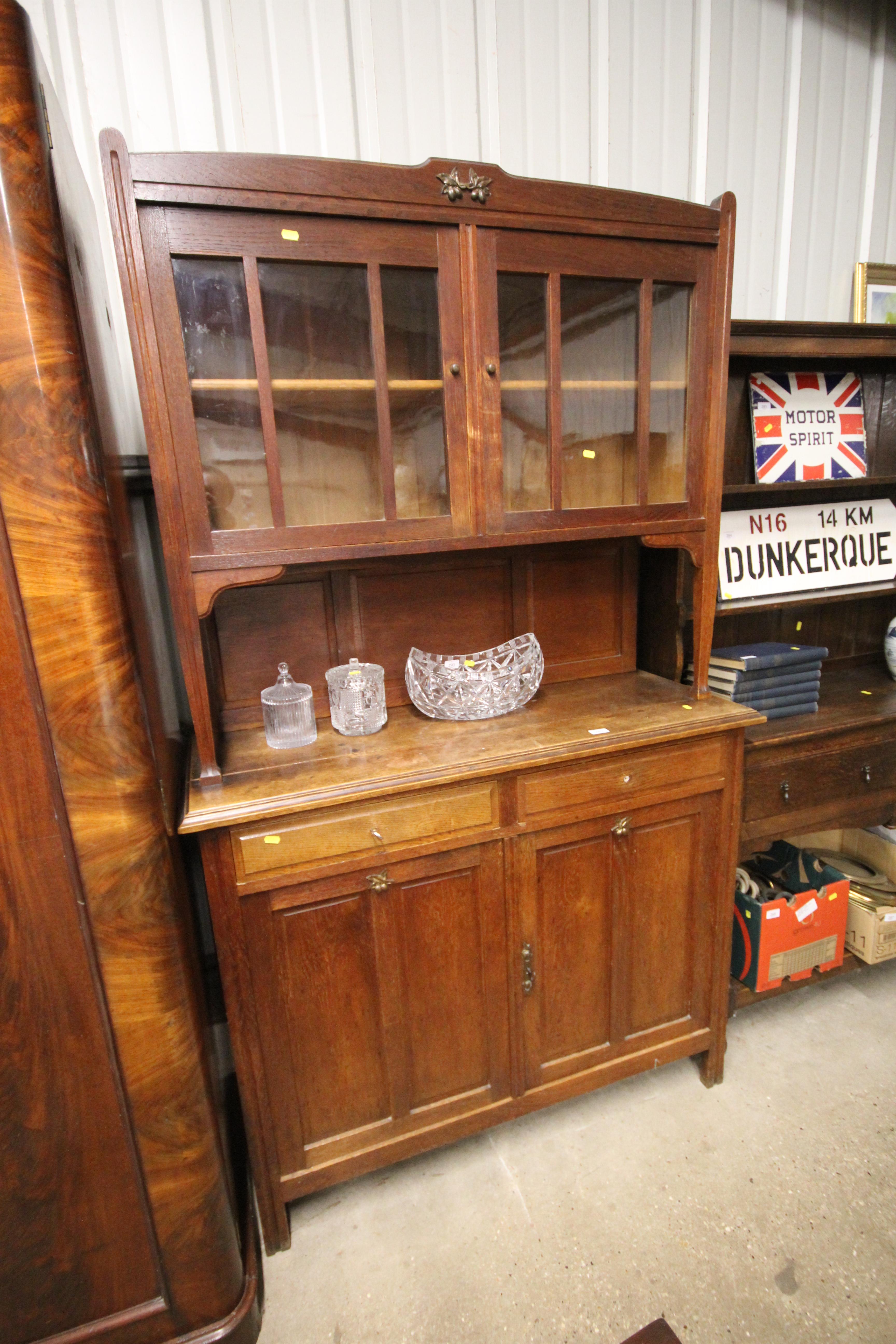 An Arts & Crafts style oak dresser with glazed top