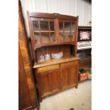 An Arts & Crafts style oak dresser with glazed top