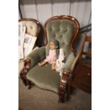A Victorian walnut framed spoon back armchair