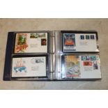 A box and an album of GB First Day covers