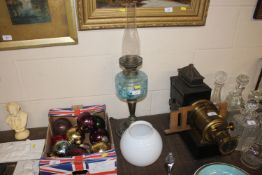 A Victorian brass based oil lamp with blue glass r