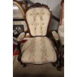 A Victorian walnut framed spoon back armchair