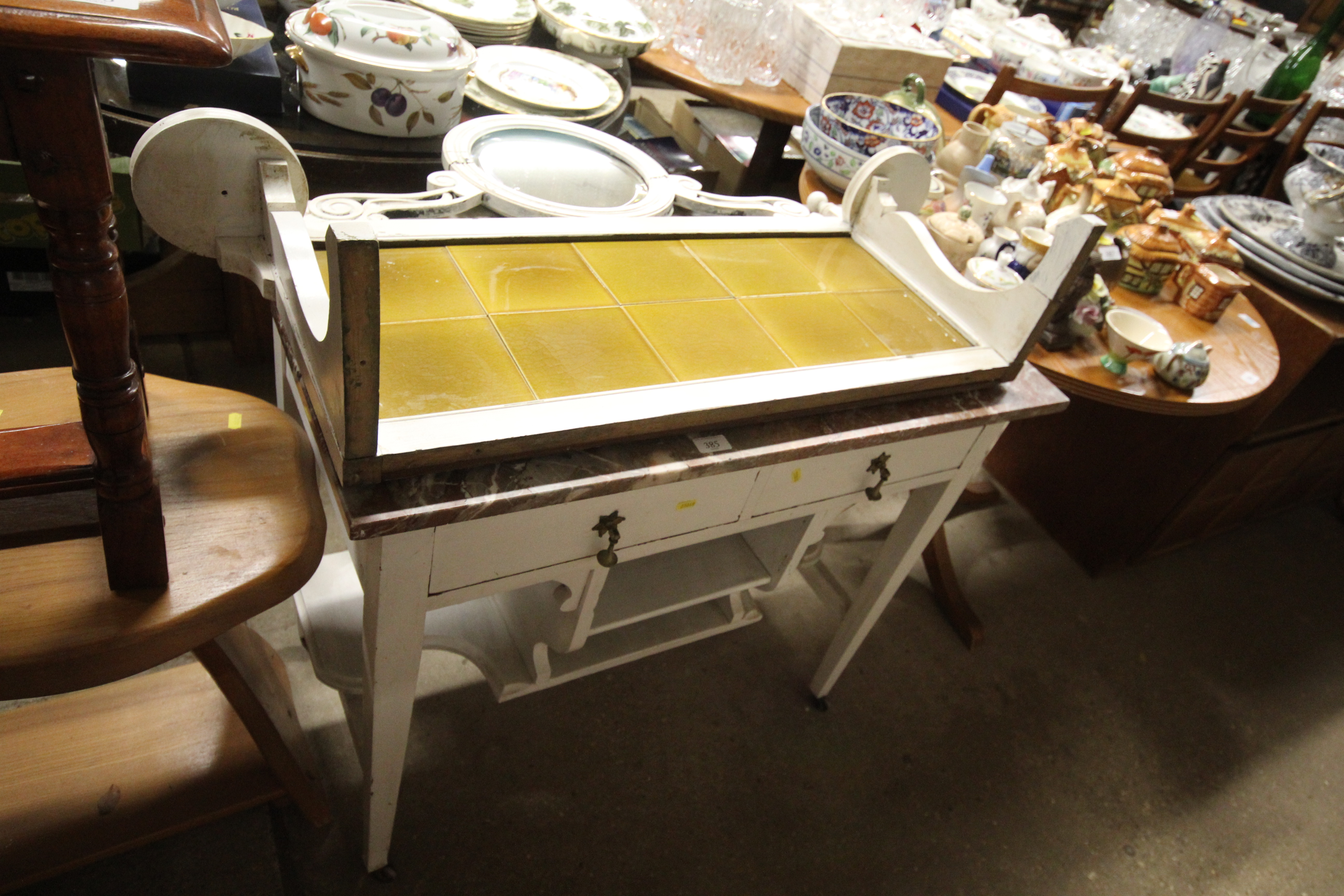 An Edwardian white painted tile back washstand