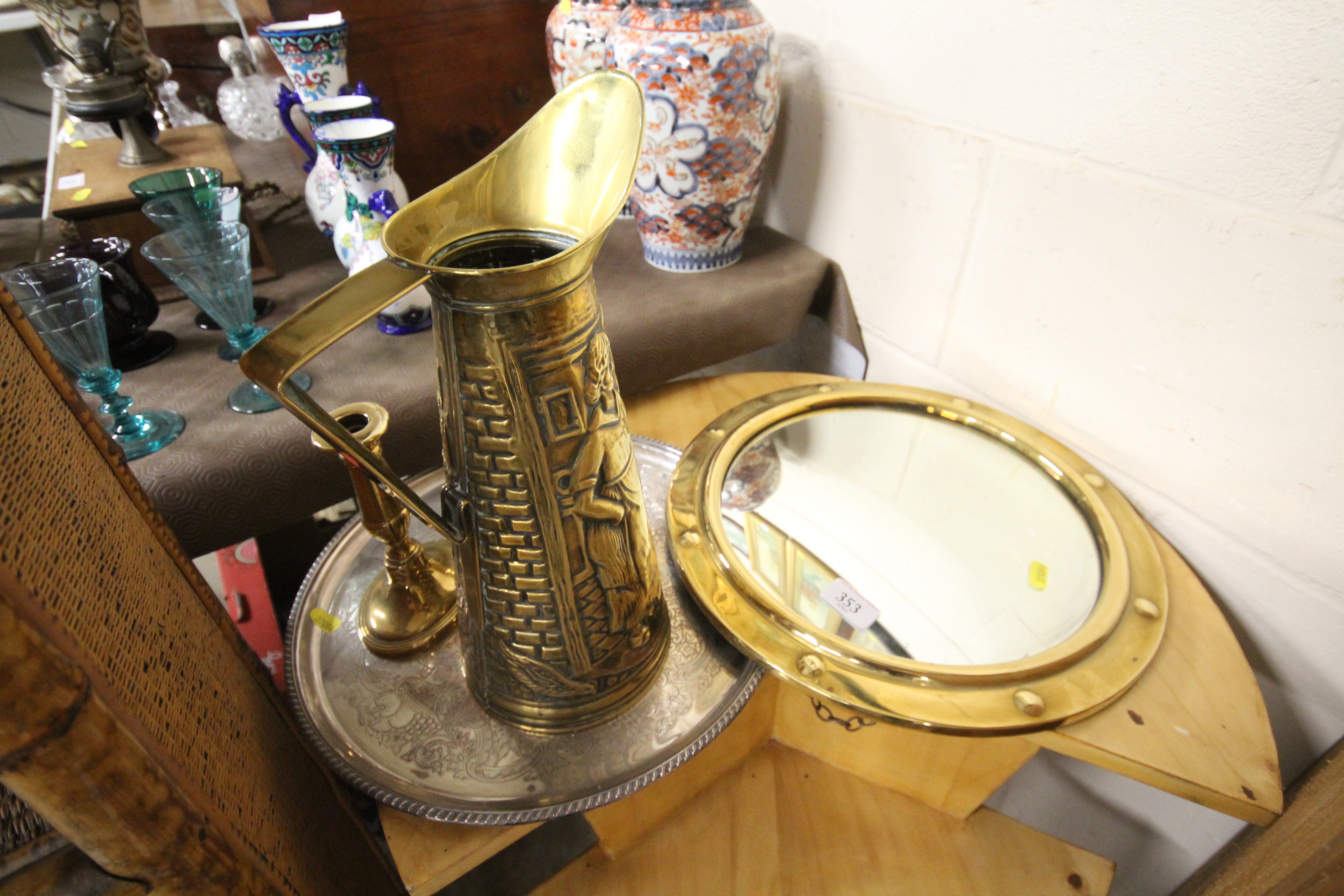 A circular convex brass farmed wall mirror; a bras