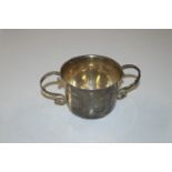 A London silver twin handled loving cup, initialle