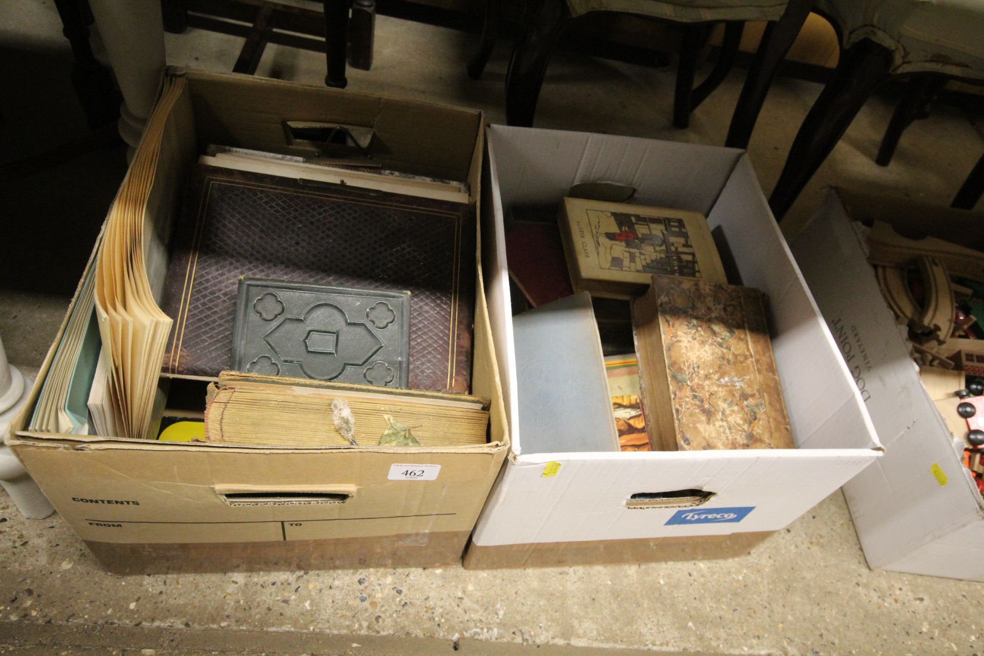 Two boxes containing books and photo albums