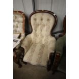 A Victorian mahogany framed spoon back armchair