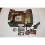 A box of various items to include barometers, mini