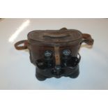 A pair of US made binoculars in fitted leather cas