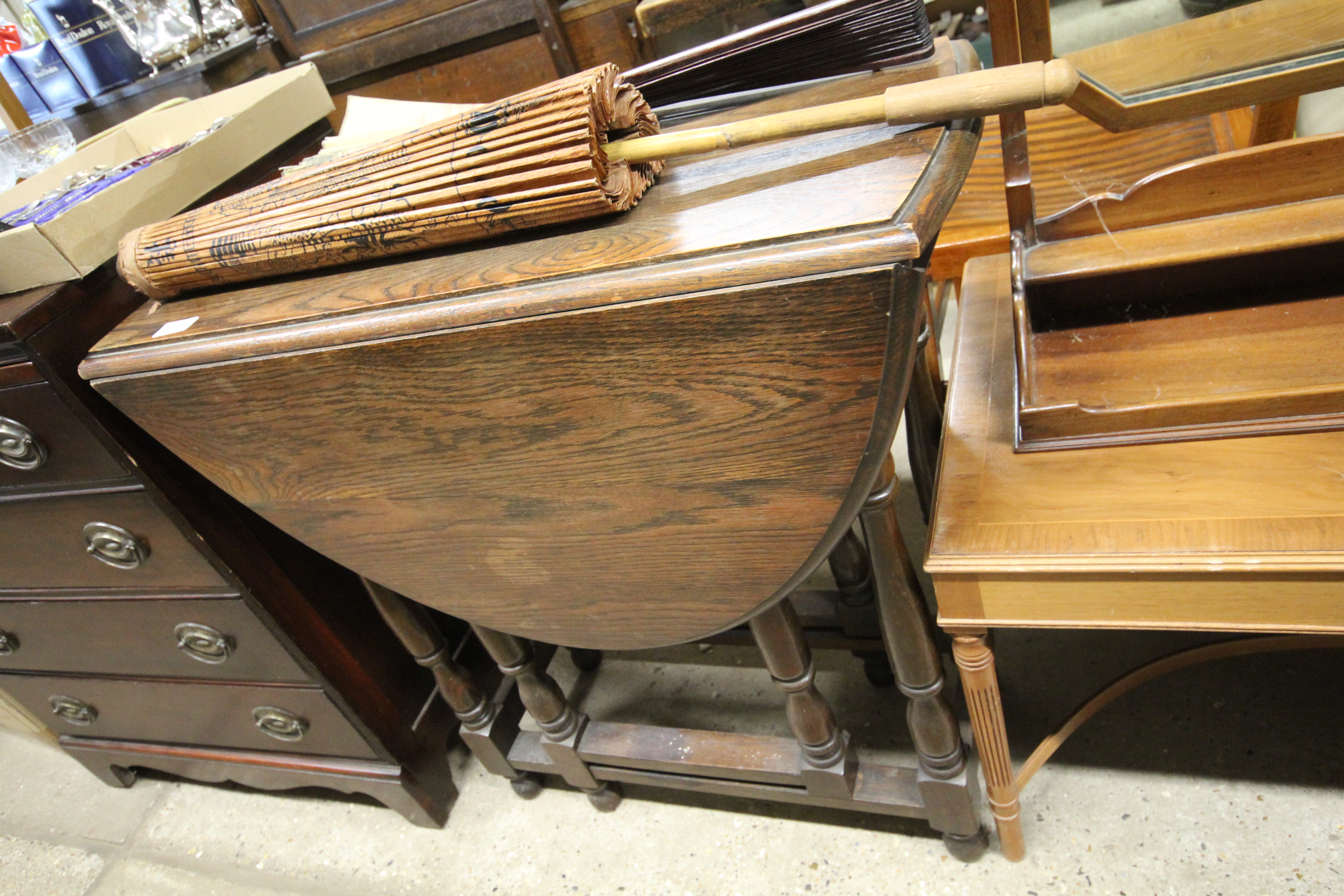 A 1930's oak gate leg tea table