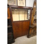 A 20th Century mahogany display cabinet with cupbo