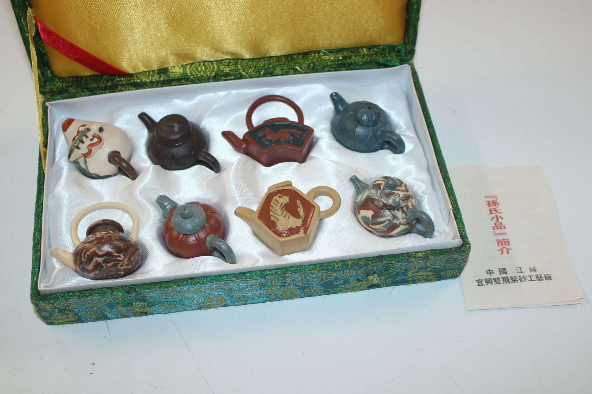 A boxed set of eight Chinese Yixing pottery water