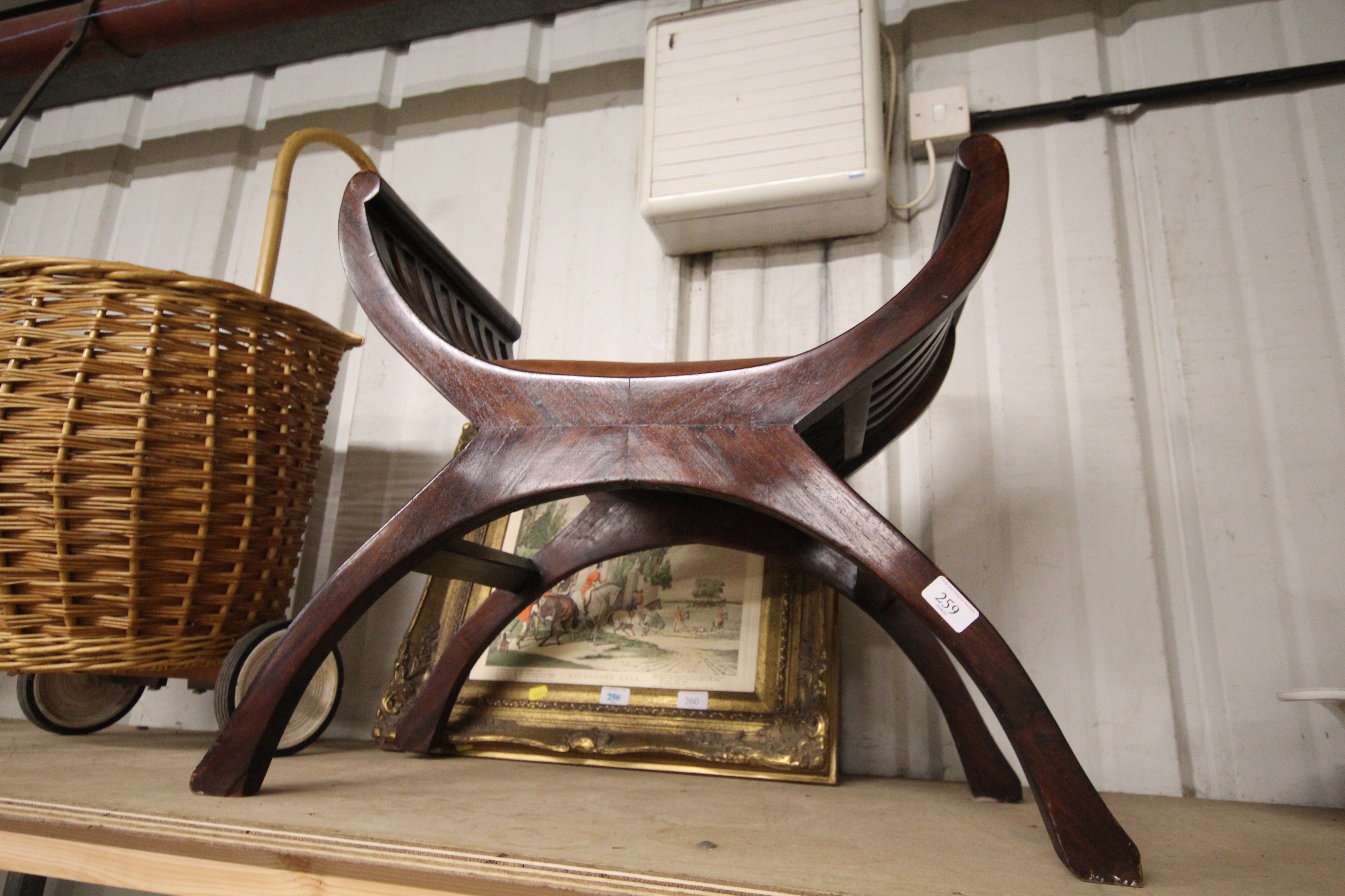 A hardwood X frame stool