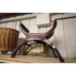 A hardwood X frame stool