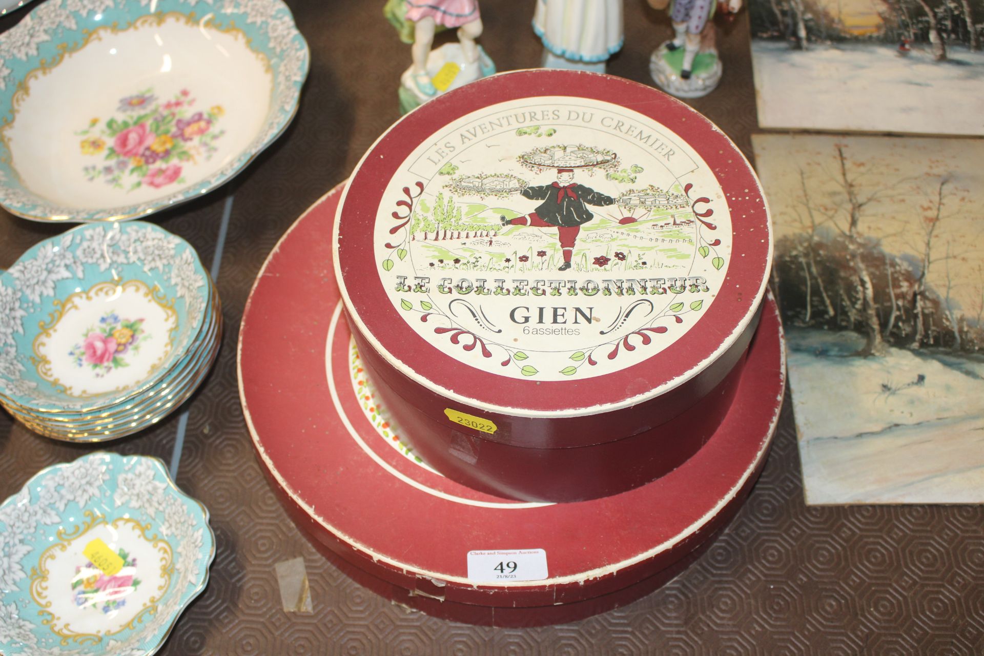 A collection of boxed Gien plates