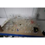 A quantity of advertising glasses