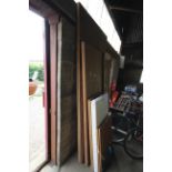 A wooden door, five various sheets of plywood etc.