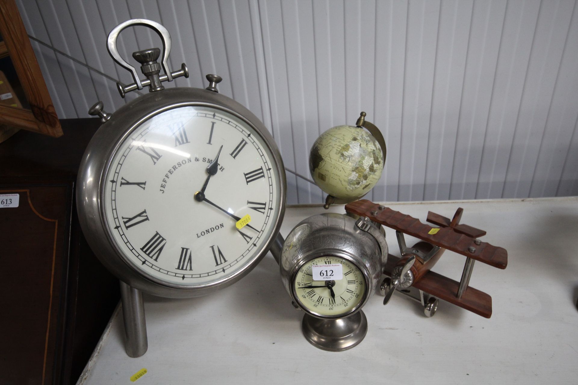 A desk globe, wooden and metal biplane, easel cloc