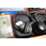 A pair of BOSE wireless headphones in case