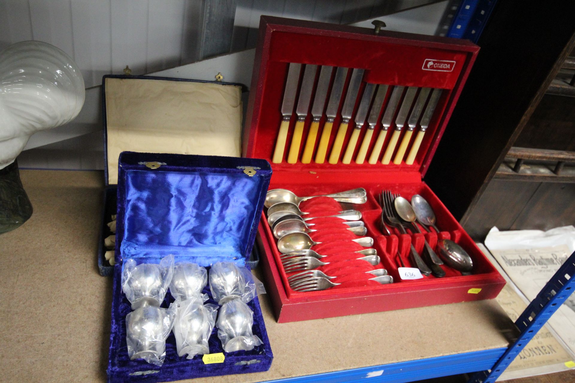 An Oneida canteen of cutlery, a cased set of six plated goblets, and a cased set of fish knives