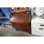 A Georgian mahogany bureau fitted four drawers rai