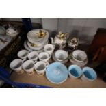 A small quantity of Poole two tone tea ware, a quantity of iron stone "Harmony" pattern tea and