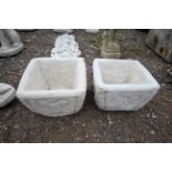 A pair of cast concrete garden planters