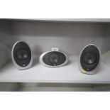 Three Kef speakers