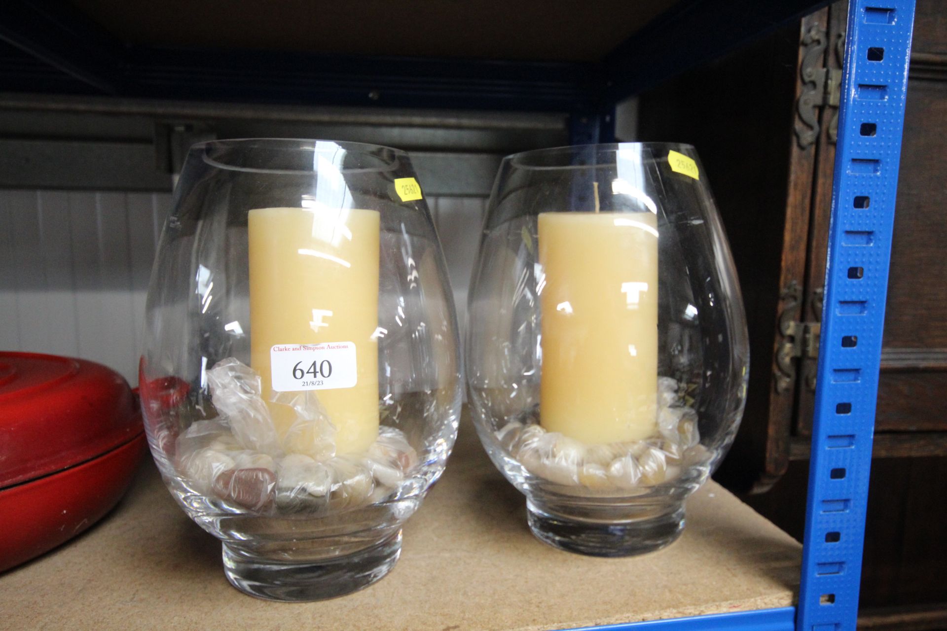 A pair of glass candle holders