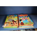 A quantity of Beano annuals and vintage newspapers