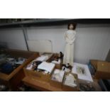 Five boxes of various porcelain doll making equipm