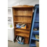 A pine open fronted bookcase