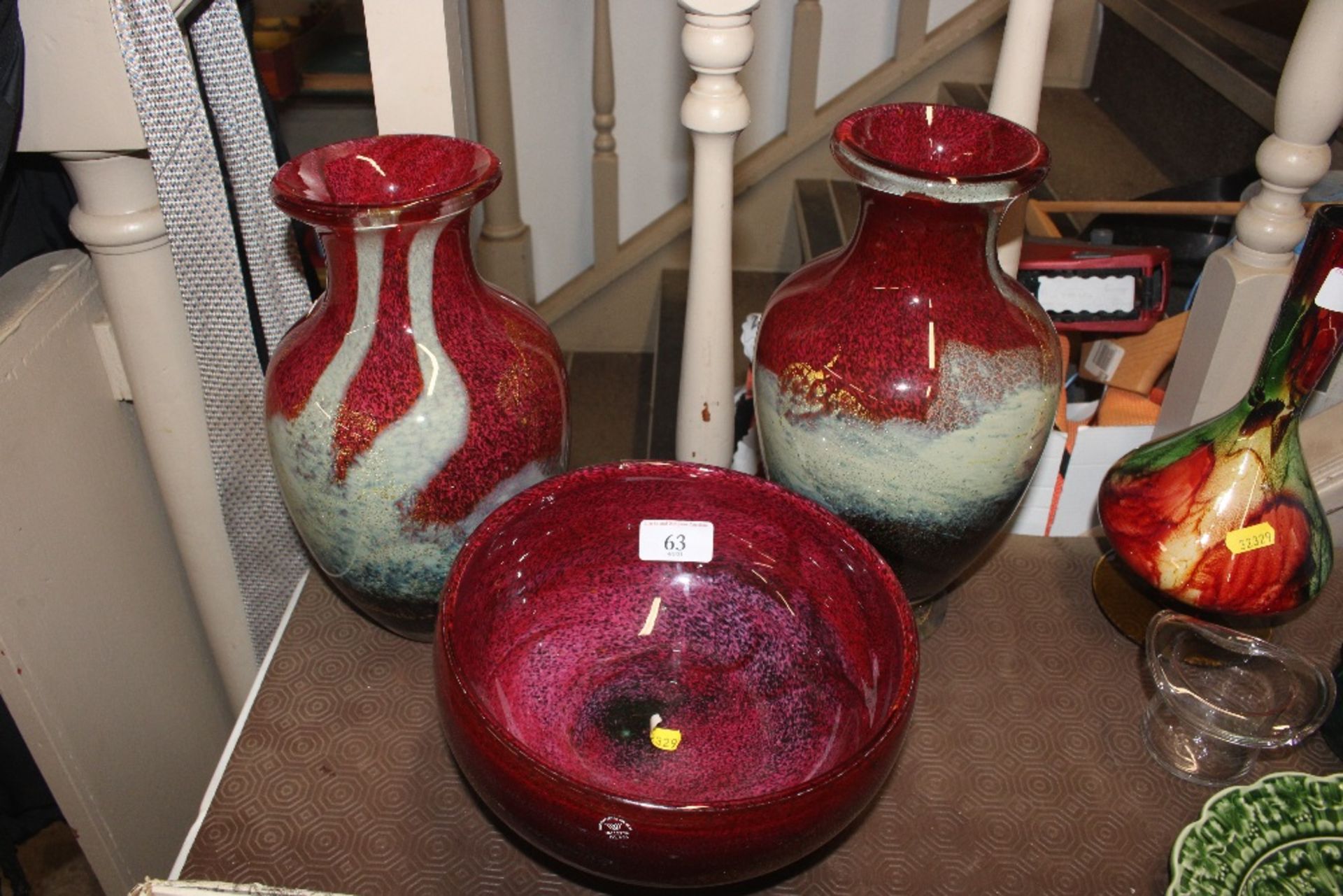 A Mdina glass bowl and two matching vases