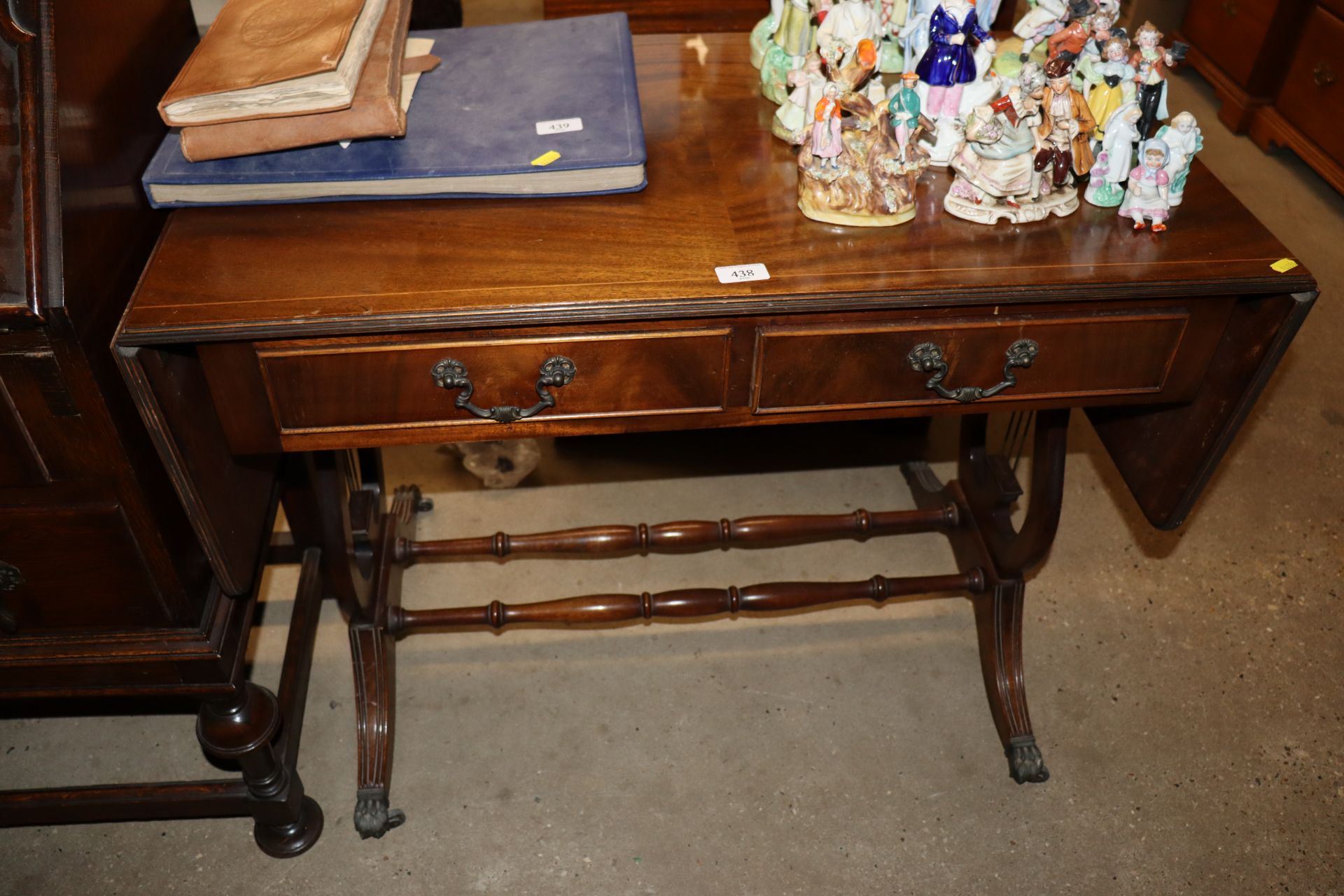 A reproduction mahogany two drawer sofa table