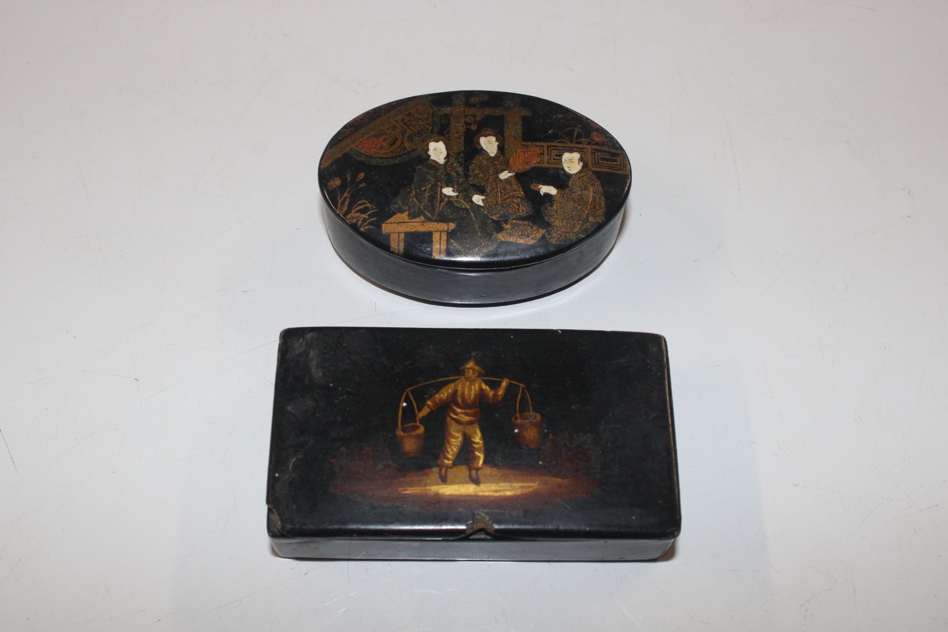 An antique Oriental lacquered oval snuff box, and