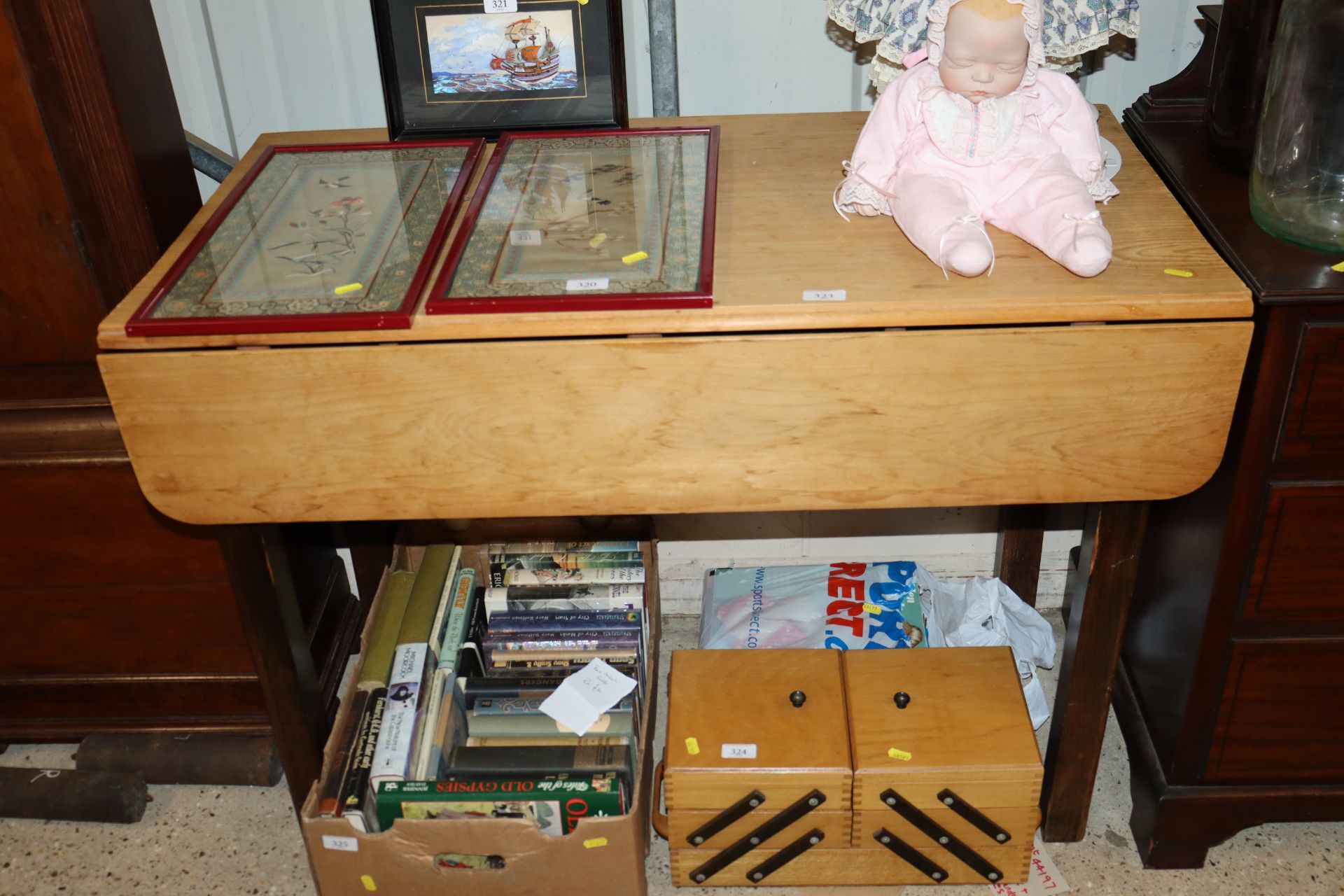 A stripped pine topped drop leaf table